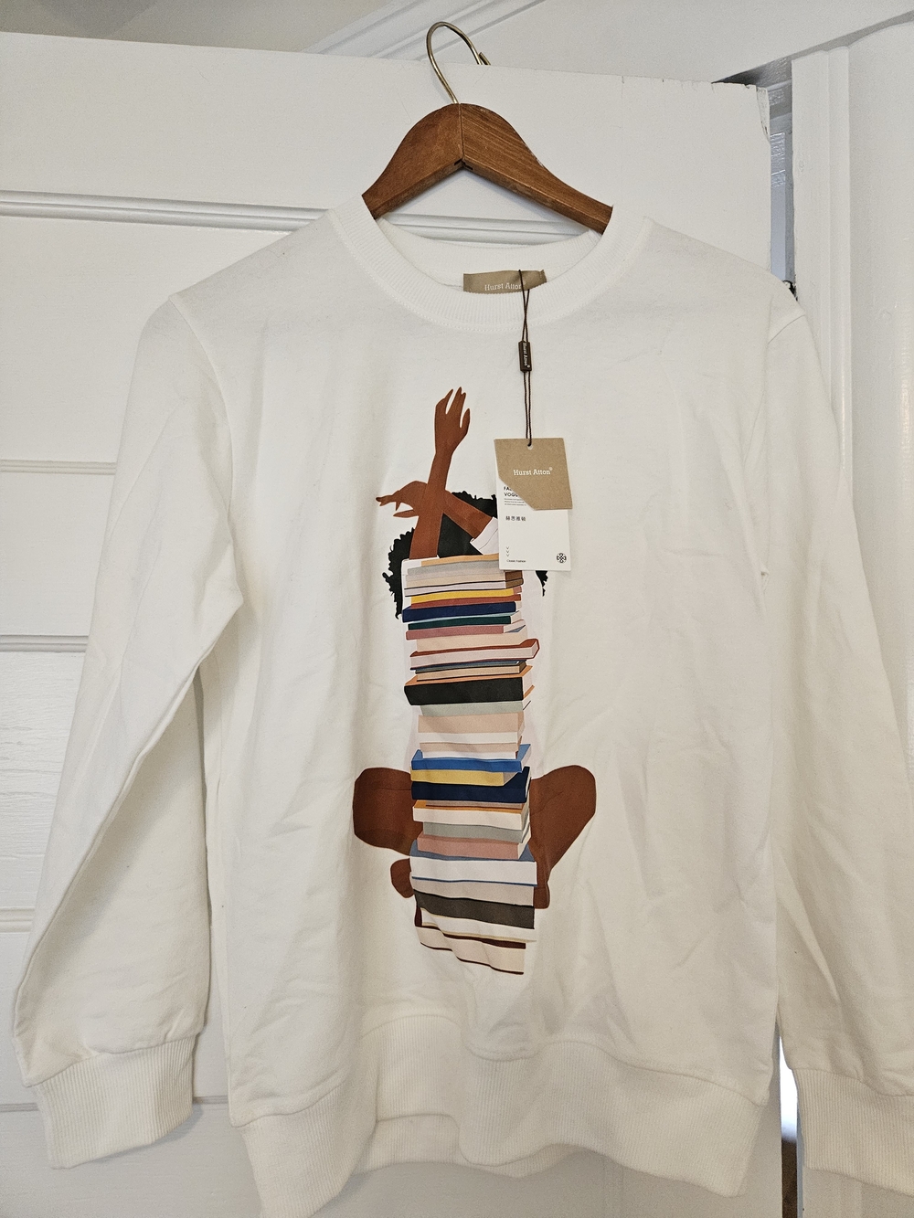 White Graphic Crewneck Sweatshirt with Book Stack Print